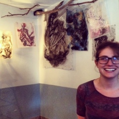 Andrea Jane (A.J.) Springer in front of her show, Submerged